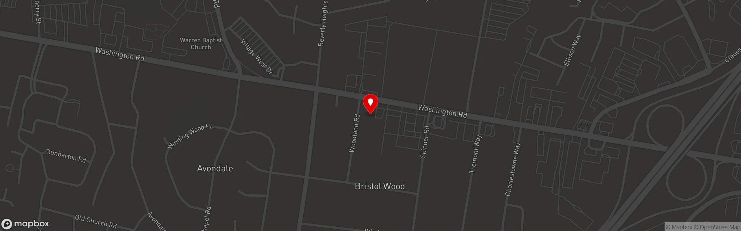 A dark map showing Washington Rd, with highlighted streets like Woodland Rd and Dunbarton Rd, featuring nearby landmarks.